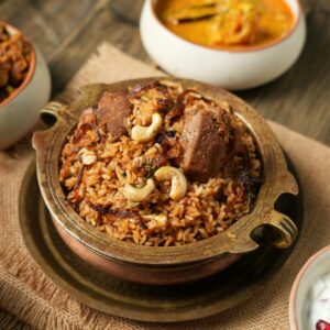 Tantalizing Indian biryani with tempting side dishes captured in Chennai, India.
